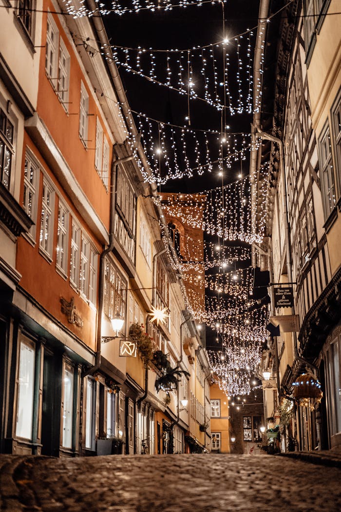 Cozy street in Erfurt, Germany, adorned with beautiful festive lights at night.